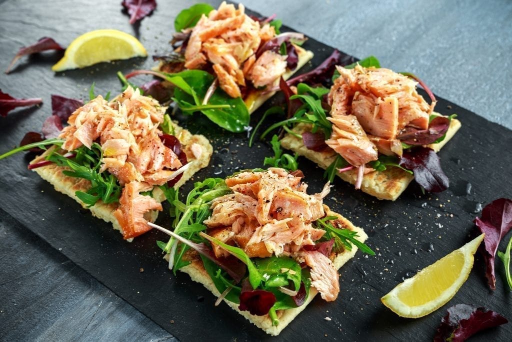 snacks and appetizers: Smoked salmon flakes on salad bed and irish potato slims 