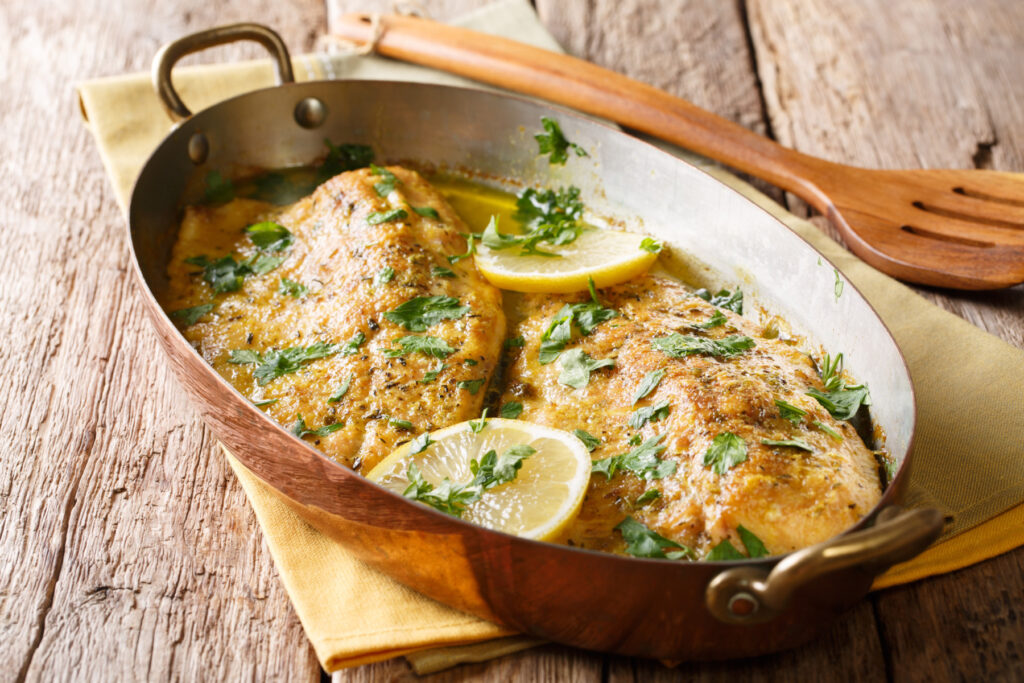 braised trout topped with parsley