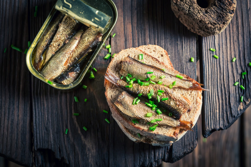 Healthy sandwich wirh sardines with on the wholegrain bread