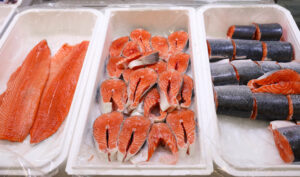 Fresh fish on display with ice at wholesale market